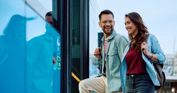 passengers happily boarding a bus